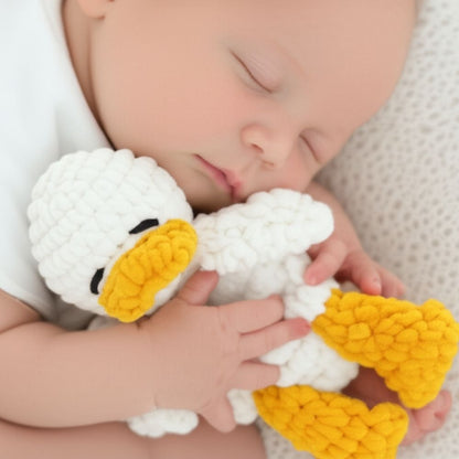 Newborn sleeping with plush crochet duck – handmade baby shower gift idea