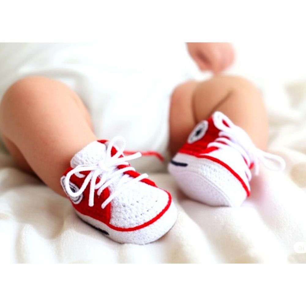 DIY crochet baby shoes worn by newborn – Soft, safe, and comfortable handmade footwear pattern.