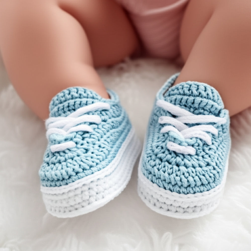 Crochet baby sneakers worn by newborn — step-by-step pattern and tutorial
