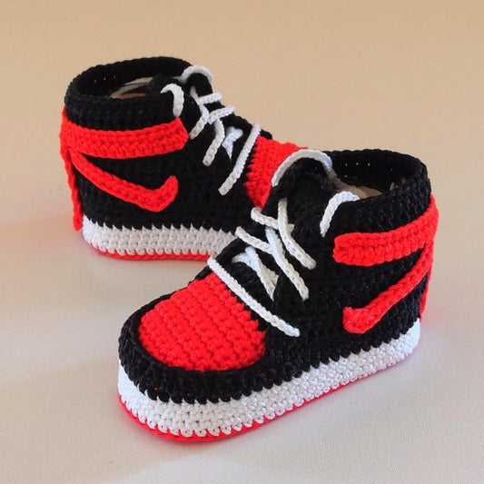 Crochet pattern of baby basketball sneakers, emphasizing the handmade quality and sporty design inspired by Nike® Jordans®