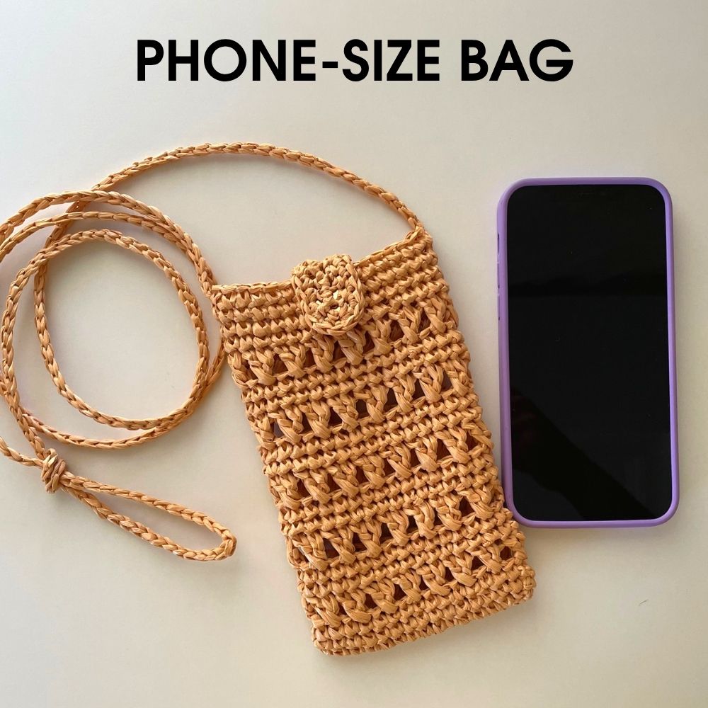 Crochet raffia bag pattern shown with phone for size reference